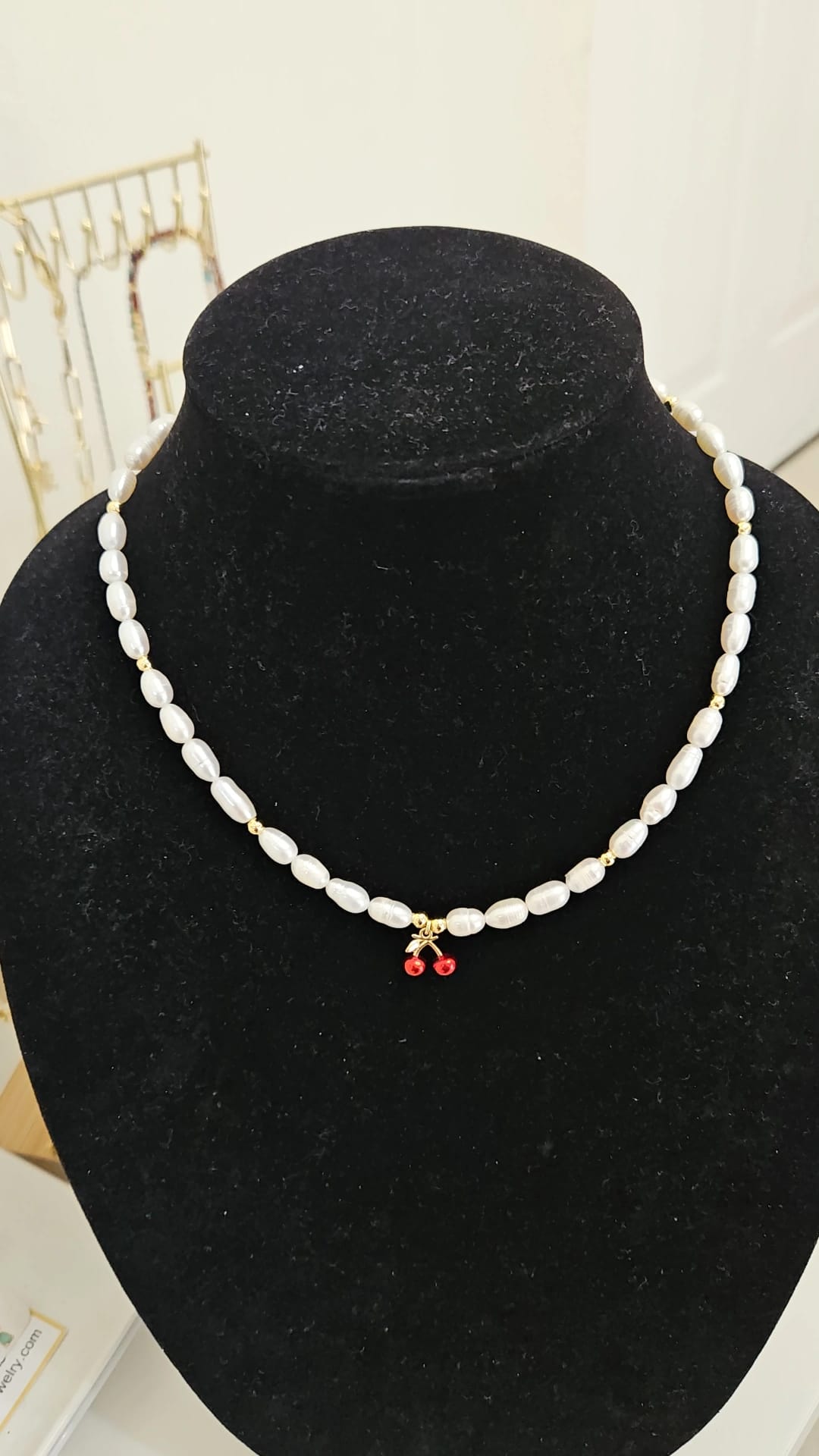 Pearl necklace with cherry